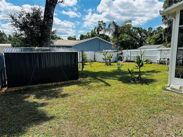 606 W Voorhis Ave, Deland, FL 32720 - view of yard featuring an outbuilding, a shed, and a fenced backyard