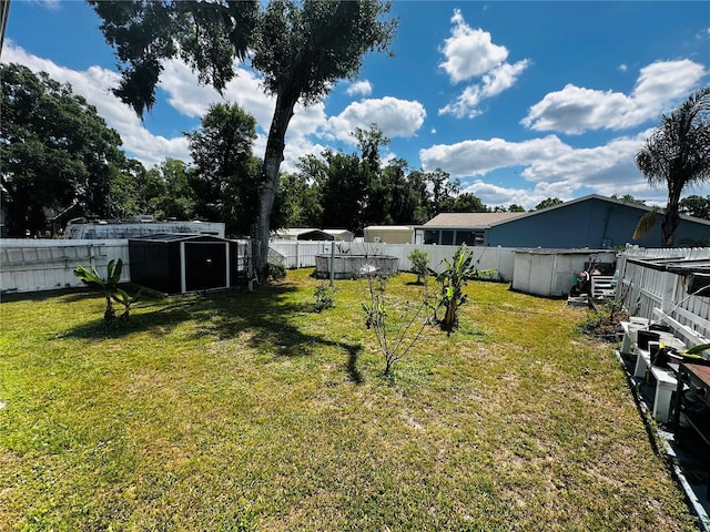 606 W Voorhis Ave, Deland, FL 32720 - view of yard with a fenced backyard, an outbuilding, a pool, and a shed