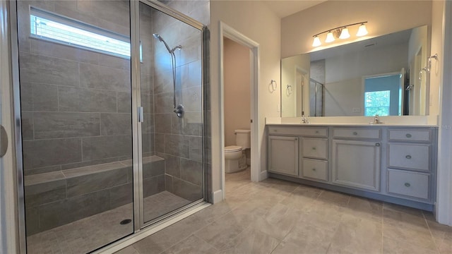1002 Chelan Falls Dr, Deland, FL 32724 - bathroom featuring a shower stall, a wealth of natural light, toilet, and a sink