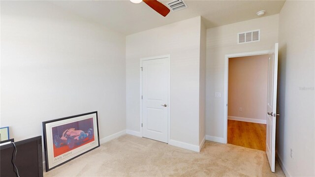 1002 Chelan Falls Dr, Deland, FL 32724 - interior space with carpet floors, visible vents, a ceiling fan, and baseboards