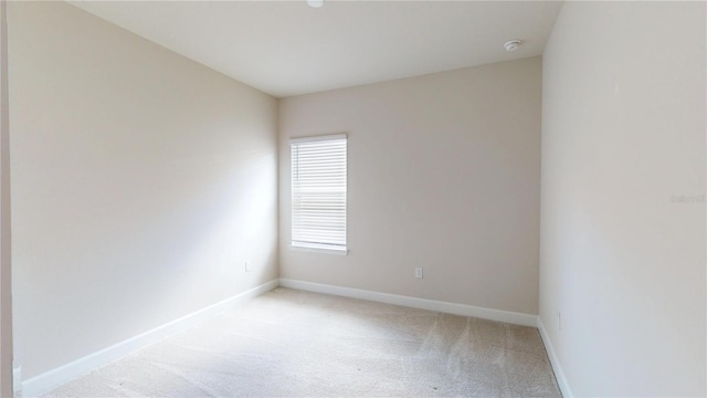 1002 Chelan Falls Dr, Deland, FL 32724 - empty room with light carpet and baseboards