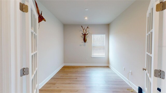 1002 Chelan Falls Dr, Deland, FL 32724 - spare room with recessed lighting, light wood-style flooring, and french doors