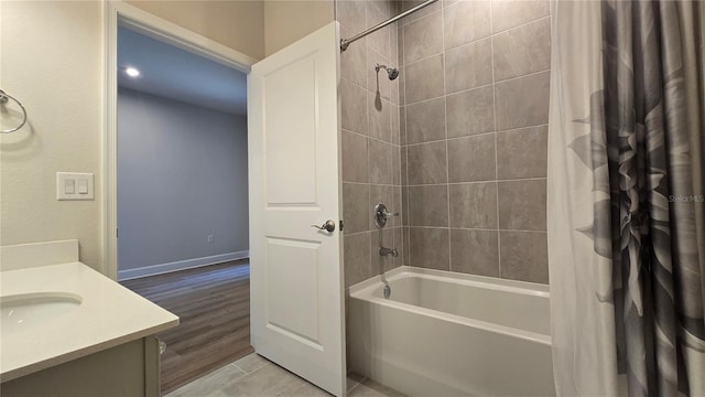 1002 Chelan Falls Dr, Deland, FL 32724 - bathroom with baseboards, shower / bath combo with shower curtain, and vanity