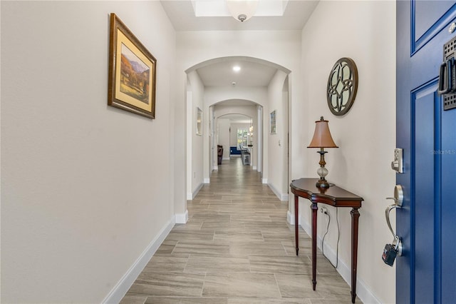 2901 Monaghan Dr, Ormond Beach, FL 32174 - hallway with arched walkways and baseboards