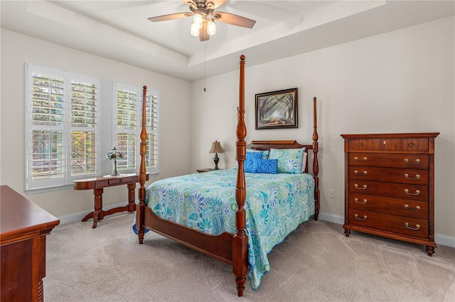 2901 Monaghan Dr, Ormond Beach, FL 32174 - bedroom with light colored carpet, ceiling fan, baseboards, and a raised ceiling