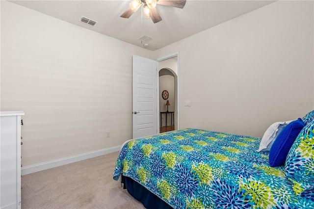 2901 Monaghan Dr, Ormond Beach, FL 32174 - carpeted bedroom featuring arched walkways, visible vents, baseboards, and ceiling fan