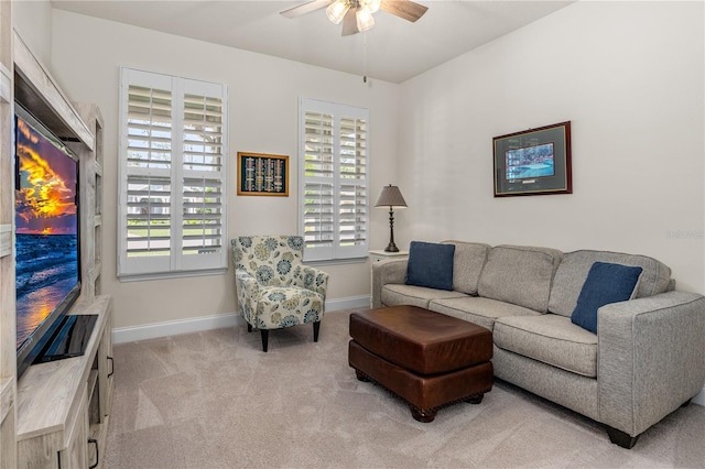 2901 Monaghan Dr, Ormond Beach, FL 32174 - living room featuring light colored carpet, ceiling fan, and baseboards