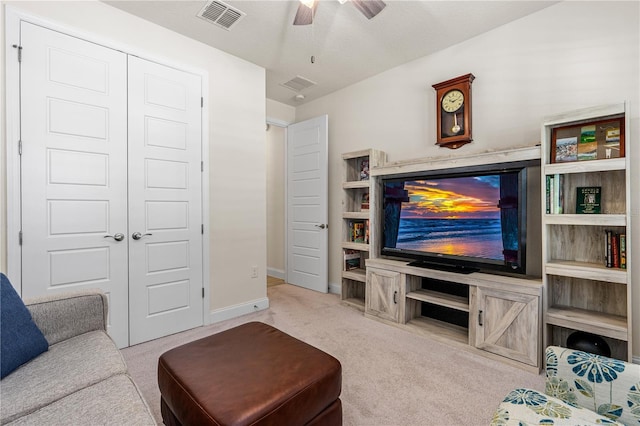 2901 Monaghan Dr, Ormond Beach, FL 32174 - carpeted living room featuring visible vents, baseboards, and ceiling fan