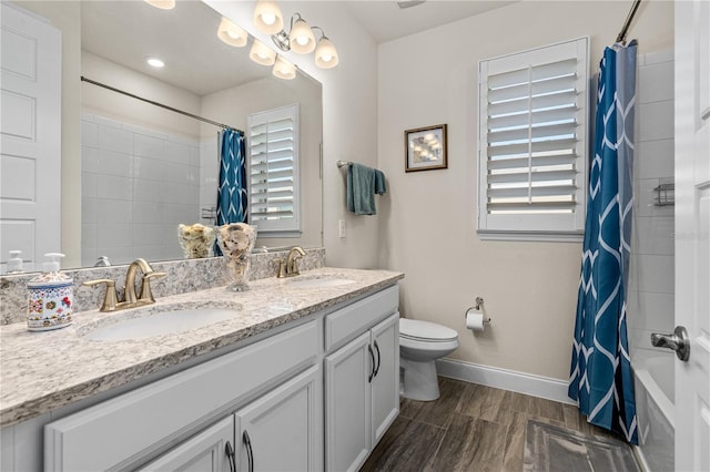 2901 Monaghan Dr, Ormond Beach, FL 32174 - full bath with toilet, a sink, double vanity, and baseboards