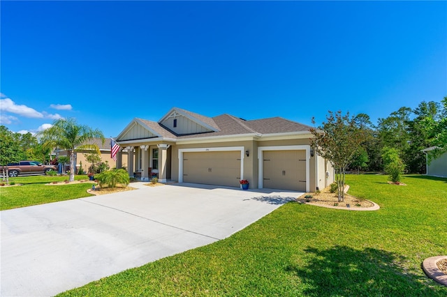 2901 Monaghan Dr, Ormond Beach, FL 32174 - view of front of home with driveway, an attached garage, a front yard, stucco siding, and roof with shingles