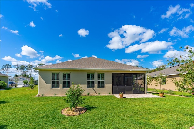2901 Monaghan Dr, Ormond Beach, FL 32174 - rear view of property with a lawn, a sunroom, and stucco siding