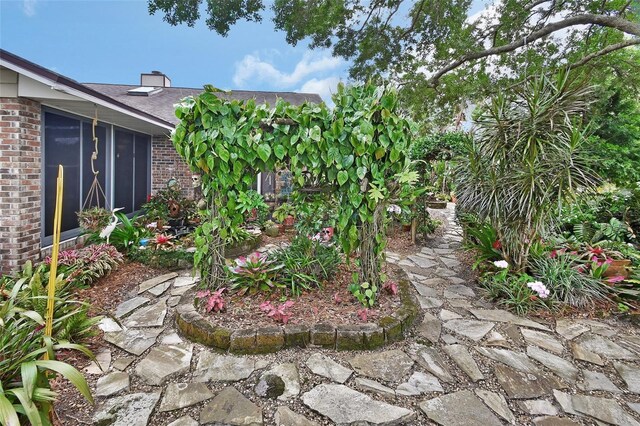 view of yard featuring a sunroom
