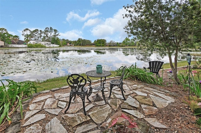 view of patio featuring a water view