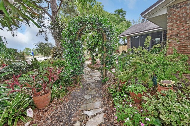 view of yard featuring a sunroom