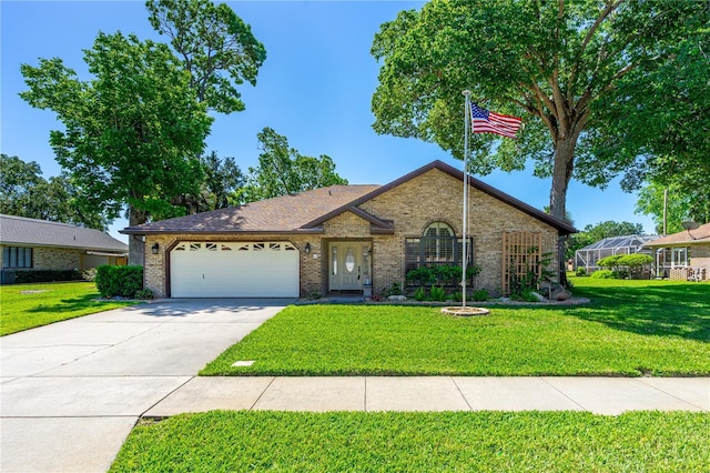 view of front of home featuring an attached garage, a front lawn, and brick siding