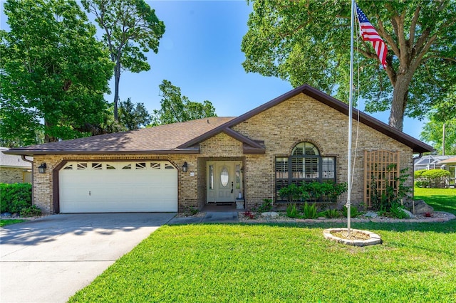 ranch-style home with an attached garage, a front lawn, driveway, and brick siding