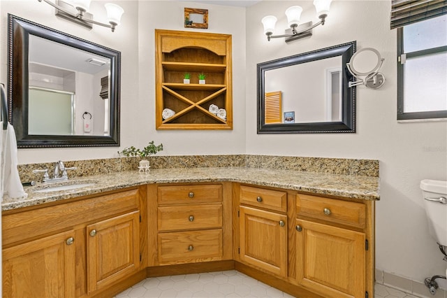 full bathroom with a shower with door, toilet, tile patterned floors, and vanity