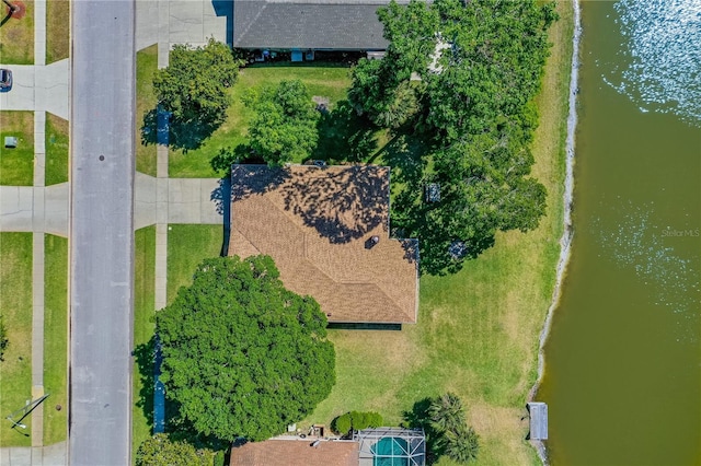 birds eye view of property with a water view
