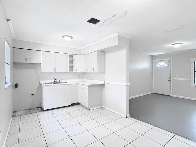 kitchen with white cabinets, a sink, baseboards, open shelves, and light countertops