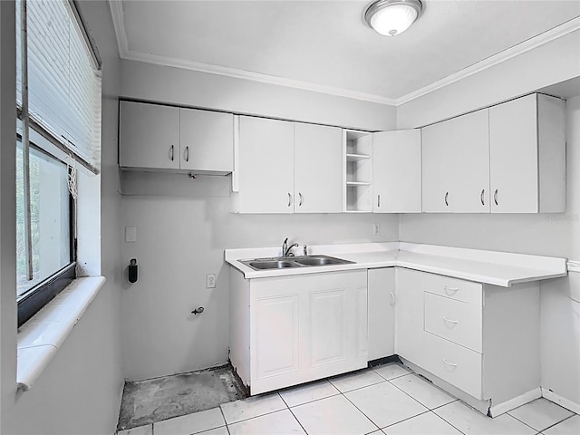 kitchen with open shelves, light countertops, ornamental molding, and a sink
