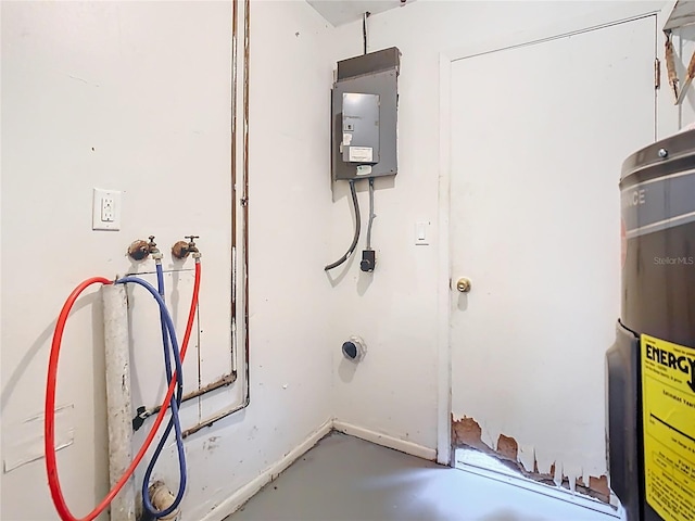 utility room featuring water heater