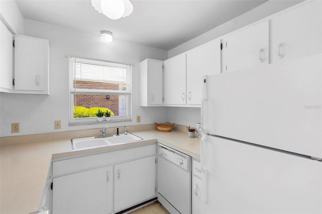 3 Fairway Ct, Deland, FL 32724 - kitchen with light countertops, white cabinets, a sink, and white appliances