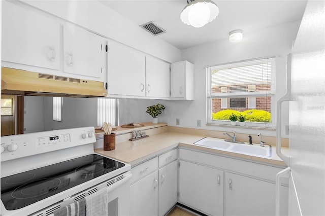 3 Fairway Ct, Deland, FL 32724 - kitchen with a sink, light countertops, electric range, white cabinets, and under cabinet range hood