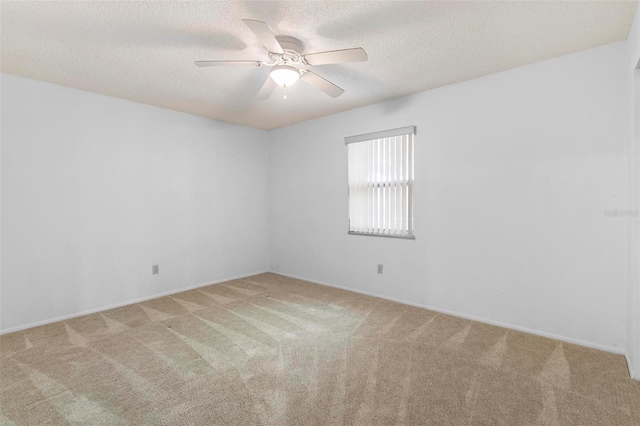 3 Fairway Ct, Deland, FL 32724 - empty room featuring a ceiling fan, baseboards, carpet floors, and a textured ceiling