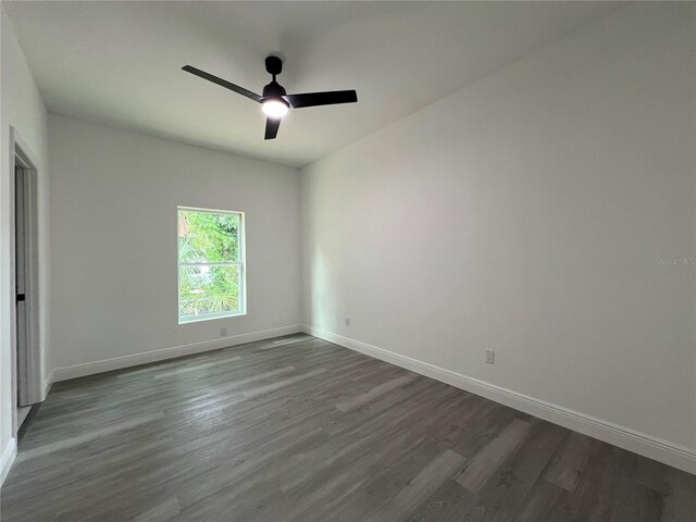 516 Model St, Daytona Beach, FL 32114 - spare room with dark wood finished floors and a ceiling fan