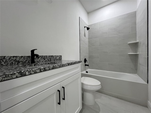 516 Model St, Daytona Beach, FL 32114 - full bathroom featuring vanity, shower / tub combination, and marble look tile flooring