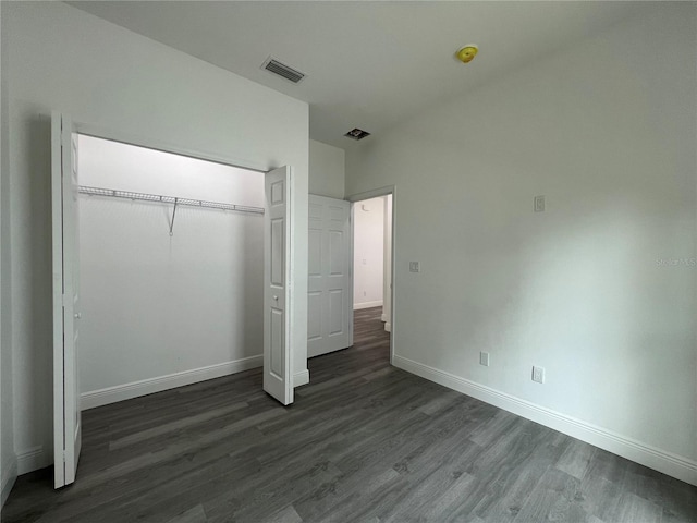 516 Model St, Daytona Beach, FL 32114 - unfurnished bedroom with dark wood finished floors and a closet