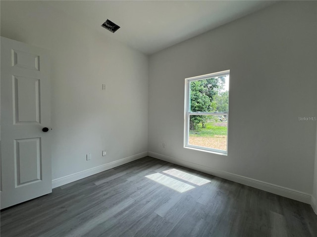516 Model St, Daytona Beach, FL 32114 - unfurnished room featuring baseboards and dark wood-style floors
