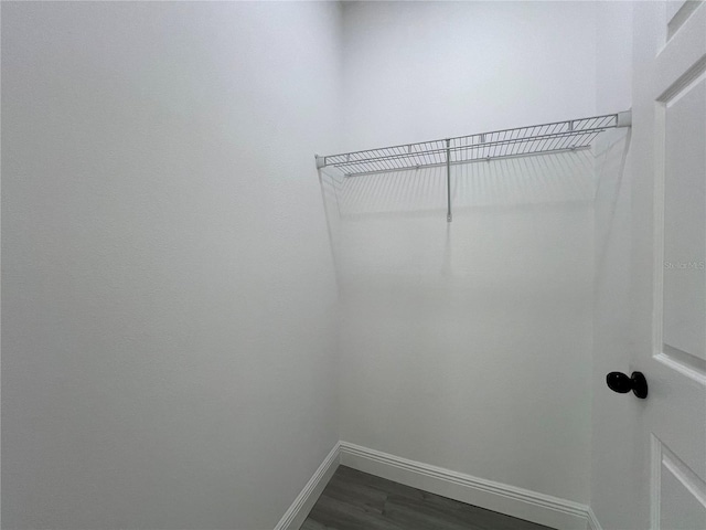 516 Model St, Daytona Beach, FL 32114 - spacious closet with dark wood-type flooring