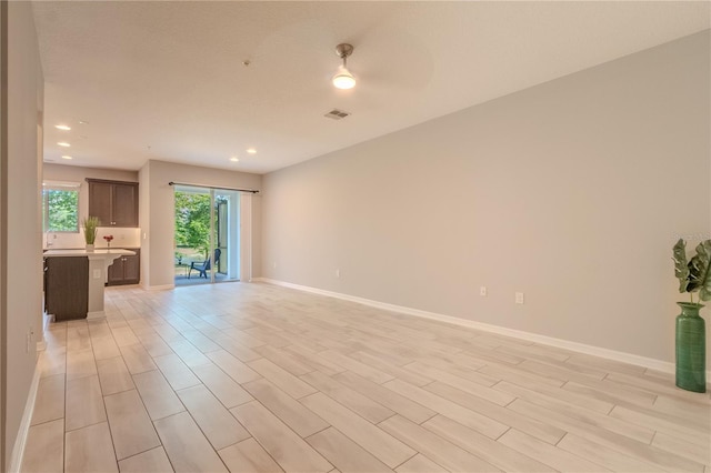 258 Rustic Loop, Sanford, FL 32771 - empty room featuring recessed lighting, light wood-style flooring, and baseboards