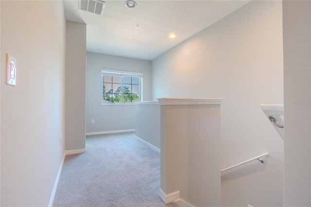258 Rustic Loop, Sanford, FL 32771 - corridor with baseboards, visible vents, carpet, and an upstairs landing