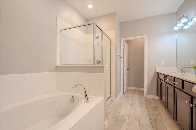 258 Rustic Loop, Sanford, FL 32771 - full bath with baseboards, a garden tub, vanity, and a stall shower
