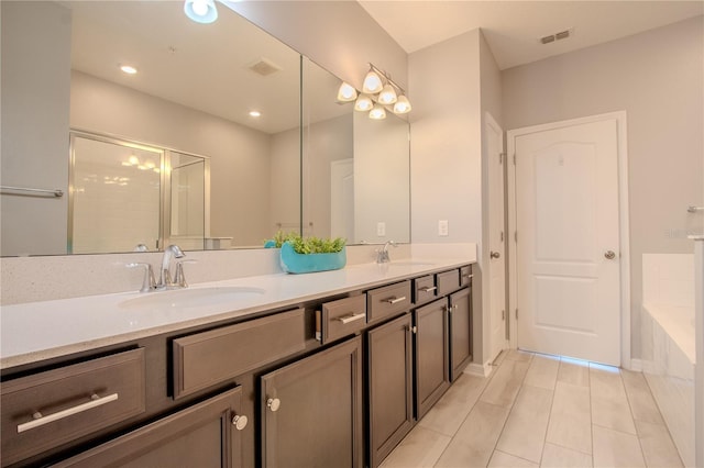 258 Rustic Loop, Sanford, FL 32771 - bathroom featuring tile patterned floors, a sink, visible vents, and double vanity