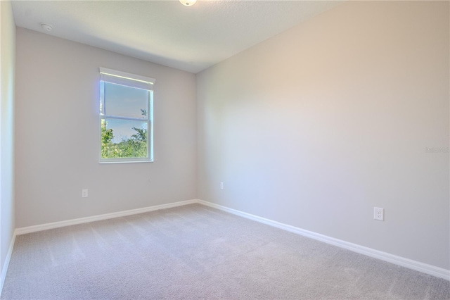 258 Rustic Loop, Sanford, FL 32771 - unfurnished room featuring baseboards and light colored carpet