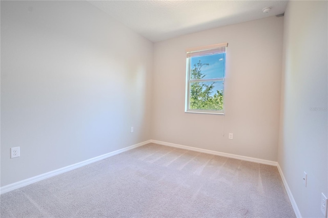 258 Rustic Loop, Sanford, FL 32771 - spare room featuring baseboards and carpet