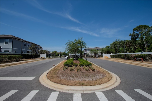 258 Rustic Loop, Sanford, FL 32771 - view of road featuring a gated entry, curbs, and a residential view