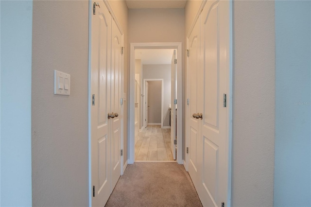 258 Rustic Loop, Sanford, FL 32771 - corridor with light carpet and baseboards
