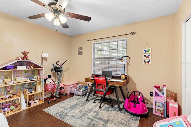 office with ceiling fan, wood finished floors, and a textured ceiling