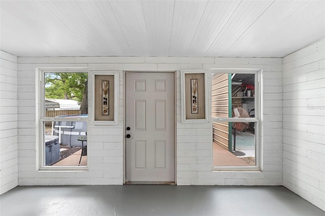 entryway with concrete floors