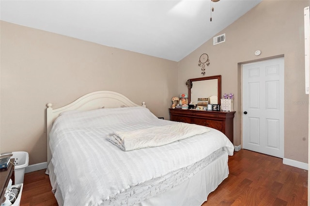 bedroom featuring vaulted ceiling, visible vents, a ceiling fan, wood finished floors, and baseboards