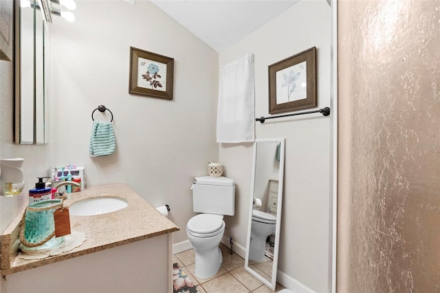 full bathroom featuring toilet, baseboards, lofted ceiling, tile patterned flooring, and vanity
