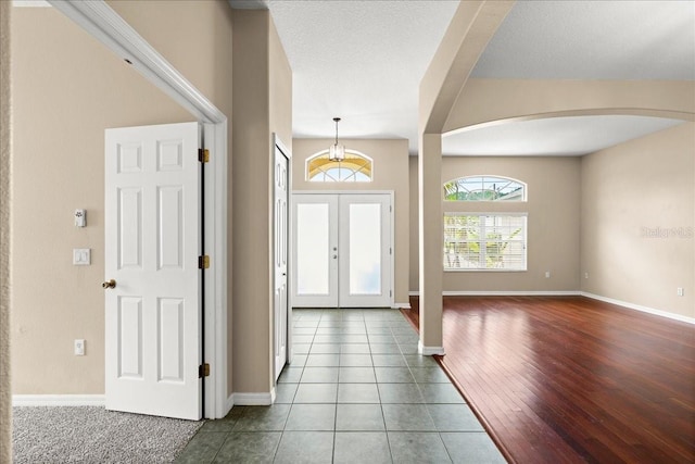 10 Zebrawood Ct, Palm Coast, FL 32164 - tiled entrance foyer with baseboards and arched walkways