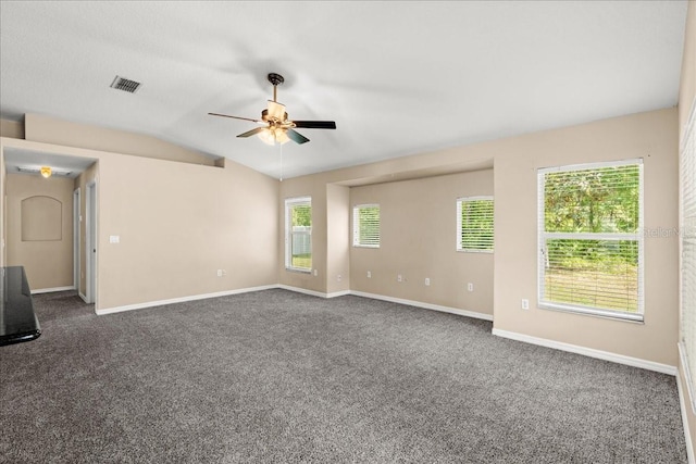10 Zebrawood Ct, Palm Coast, FL 32164 - empty room with dark colored carpet, a ceiling fan, baseboards, lofted ceiling, and visible vents