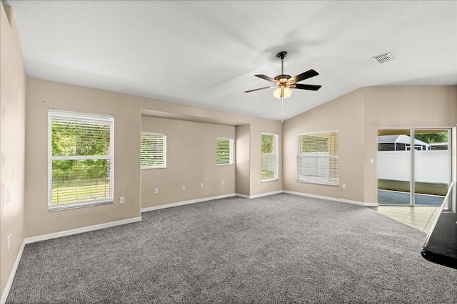 10 Zebrawood Ct, Palm Coast, FL 32164 - unfurnished living room featuring visible vents, lofted ceiling, baseboards, ceiling fan, and carpet flooring