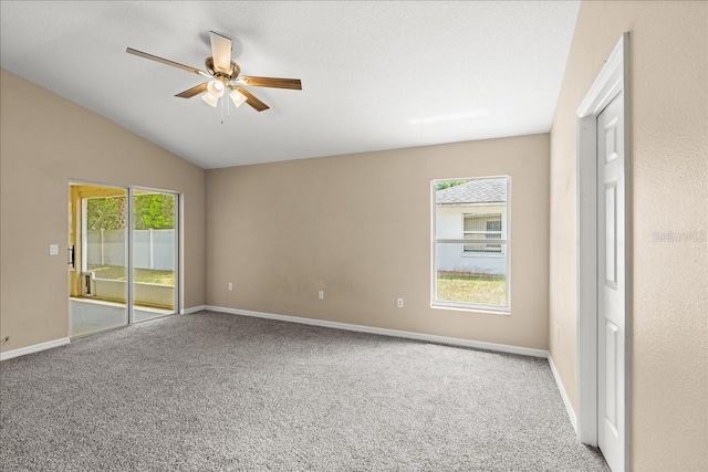 10 Zebrawood Ct, Palm Coast, FL 32164 - unfurnished room featuring carpet flooring, ceiling fan, vaulted ceiling, and baseboards
