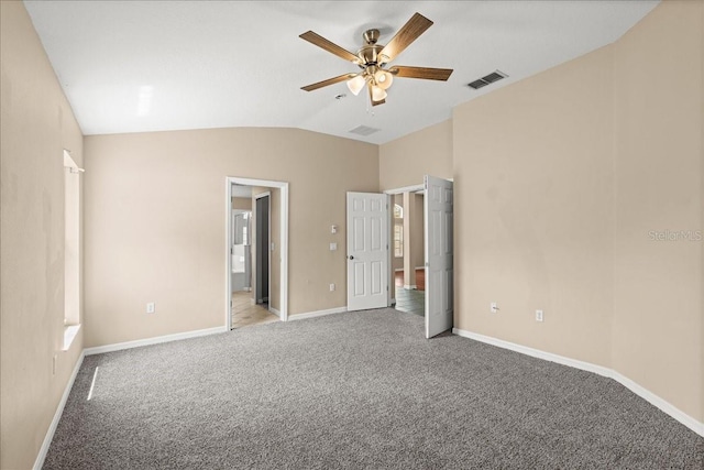 10 Zebrawood Ct, Palm Coast, FL 32164 - unfurnished bedroom with visible vents, baseboards, vaulted ceiling, and light colored carpet